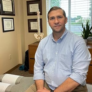 Dr. William Lust, DC, in his office